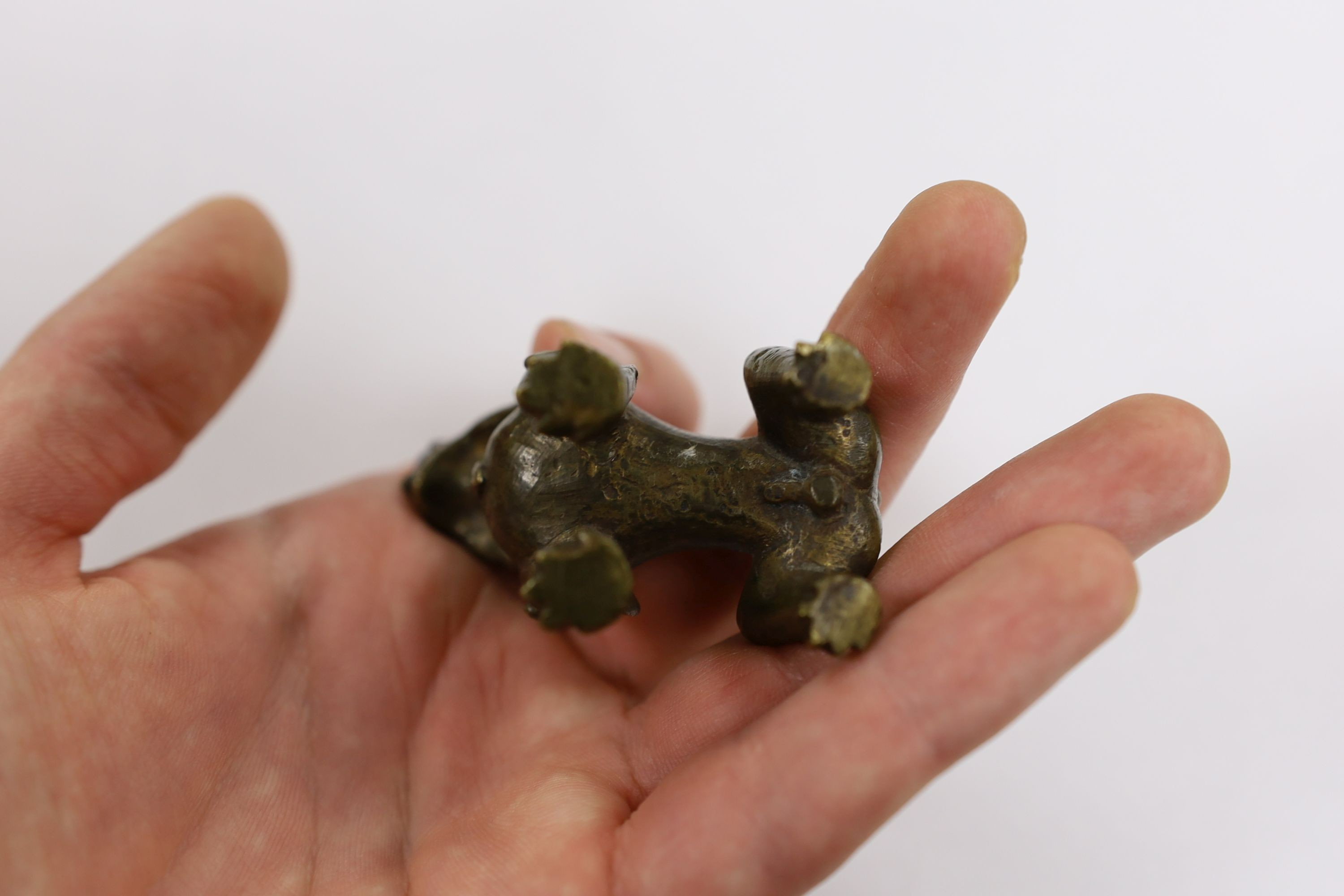 Five Chinese or Tibetan bronze figures or Buddhist implements, tallest 13cms high
